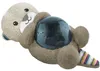 A plush toy otter lying on its back, holding a dark blue, translucent sphere in its paws. The otter has embroidered facial features and a striped tail. Produktbild-Vorschau