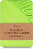 A folded fitted sheet in a bright lime green color, with a brown paper band around it containing product information. Produktbild-Vorschau