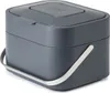 A dark gray compost bin with a silver handle, shown from a diagonal angle against a white background. Produktbild-Vorschau
