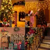A collage of four images showing Christmas decorations, including children decorating a tree, a fireplace with lights, and a staircase decorated with garland and lights. Anteprima dell’immagine prodotto