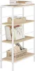 A white metal shelf unit with light oak shelves, displaying books, a mug, and baskets. Produktbild-Vorschau