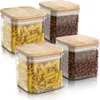 Four clear storage jars with bamboo lids, two filled with pasta and two with coffee beans, are arranged on a white surface. Náhled obrázku produktu