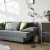 A modern living room with a gray sofa, floor lamp, and cabinet. Produktbild-Vorschau