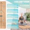 A woman meditating on a yoga mat, with instructional graphics on the left. Produktbild-Vorschau