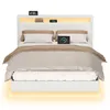 A modern white bed frame with LED lighting and integrated charging stations, shown with bedding. Náhled obrázku produktu