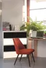 A home office setup with a chair, desk, laptop, and plant. Náhled obrázku produktu