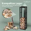 A metal firewood rack filled with logs, next to a chopping block and axe, with a close-up of logs and marketing text. Produktbild-Vorschau