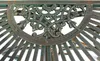 A close-up of ornate metalwork on a table or console. Produktbild-Vorschau