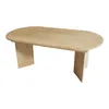 A light wood oval dining table with two pedestal legs, shown from a three-quarter angle against a white background. Anteprima dell’immagine prodotto