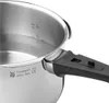Close-up view of a stainless steel pressure cooker with measurement markings inside and a black handle. Produktbild-Vorschau