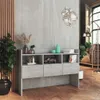 A modern living room with a gray console table displaying decorative items, plants, and books, set against a textured gray wall and wooden floor. Anteprima dell’immagine prodotto