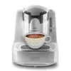 A white and gray automatic Turkish coffee maker is shown with a cup of coffee being brewed. Produktbild-Vorschau