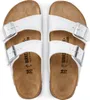 A pair of white Birkenstock sandals are shown from a top-down view against a white background. Náhľad obrázku produktu