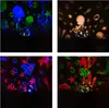 Four images showing a night sky projector projecting different underwater scenes onto a dark surface. Voir les images du produit