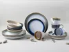 A collection of ceramic dishes and mugs arranged on a plain white background. Náhľad obrázku produktu