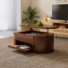 A living room scene featuring a coffee table with storage and a lift-top, placed on a rug. Produktbild-Vorschau