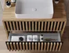 A bathroom vanity with a sink and toiletries. Produktbild-Vorschau