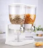 A white double cereal dispenser filled with cereal sits on a kitchen counter. Produktbild-Vorschau