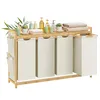 A laundry hamper with four compartments and a shelf on top, decorated with toiletries and towels. Náhled obrázku produktu