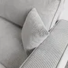 Close-up view of a light gray corduroy sofa. Produktbild-Vorschau