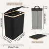 Diagram showing dimensions and features of a laundry basket. Voir les images du produit
