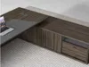 A modern L-shaped desk with a laptop on it, set against a light gray background. Náhled obrázku produktu