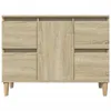 A front view of a wooden cabinet with drawers and doors, set against a white background. Náhled obrázku produktu