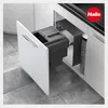 A built-in kitchen trash can system with two compartments, shown with the cabinet door open. Produktbild-Vorschau