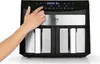 A hand is shown pressing buttons on the control panel of a black and silver air fryer. Produktbild-Vorschau