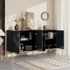 A modern black sideboard with gold accents and legs, styled in a living room setting with decorative items. Anteprima dell’immagine prodotto