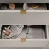 Close-up view of two open drawers in a bathroom cabinet, showing organized storage. Produktbild-Vorschau