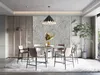 A dining room with a table and chairs, decorated with a stone-like wall panel and a plant. Produktbild-Vorschau