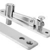 A close-up studio shot of a stainless steel door pivot hinge. Voir les images du produit