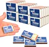 A hand holding a small box of matches with several other boxes stacked in the background. Produktbild-Vorschau