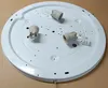 The underside of a white, round ceiling light fixture with three E27 bulb sockets and wiring connectors. Produktbild-Vorschau