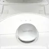 Close-up of the top of a white robot vacuum cleaner, focusing on the lidar navigation sensor and control buttons. Voir les images du produit