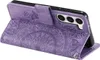A purple flip case for a Samsung Galaxy S23 phone, with a mandala embossed pattern, is shown open and at an angle. Produktbild-Vorschau