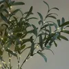 Close-up of artificial olive branches with small LED lights. Produktbild-Vorschau