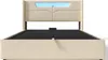 A beige upholstered bed frame with a headboard featuring integrated blue LED lighting, shown from the front. Produktbild-Vorschau