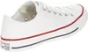 A white Converse All Star shoe is shown from the side. Voir les images du produit