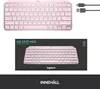 A pink Logitech MX Keys Mini keyboard is shown from two angles, with its packaging and charging cable. Anteprima dell’immagine prodotto