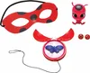 A collection of Miraculous Ladybug themed dress-up accessories, including a mask, a toy, and a necklace. Voir les images du produit