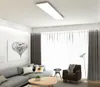 A modern living room with a sofa, armchair, coffee table, and artwork. Náhľad obrázku produktu