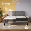 A bedroom scene with a bed, lamp, and plant, divided by yellow and purple walls. Produktbild-Vorschau