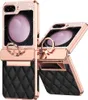 A flip phone case with a quilted black leather bottom and a rose gold frame adorned with rhinestones. Produktbild-Vorschau