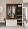 A well-lit interior scene showing an open wardrobe with clothes and accessories, next to a bench and a round mirror. Anteprima dell’immagine prodotto