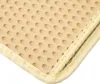 A close-up view of a beige cat litter mat with a textured surface and fabric edging. Produktbild-Vorschau