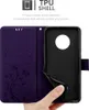A person's hand is holding a purple phone case open, revealing the black TPU shell inside. Náhľad obrázku produktu
