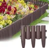 A garden border made of brown plastic elements is shown in the foreground, with a colorful flower bed in the background. Voir les images du produit