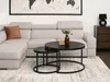 A living room scene with a sectional sofa, coffee table set, and artwork. Podgląd zdjęcia produktu